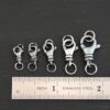 Sammy Swivel Lobster Claw - oxidized open shown by ruler