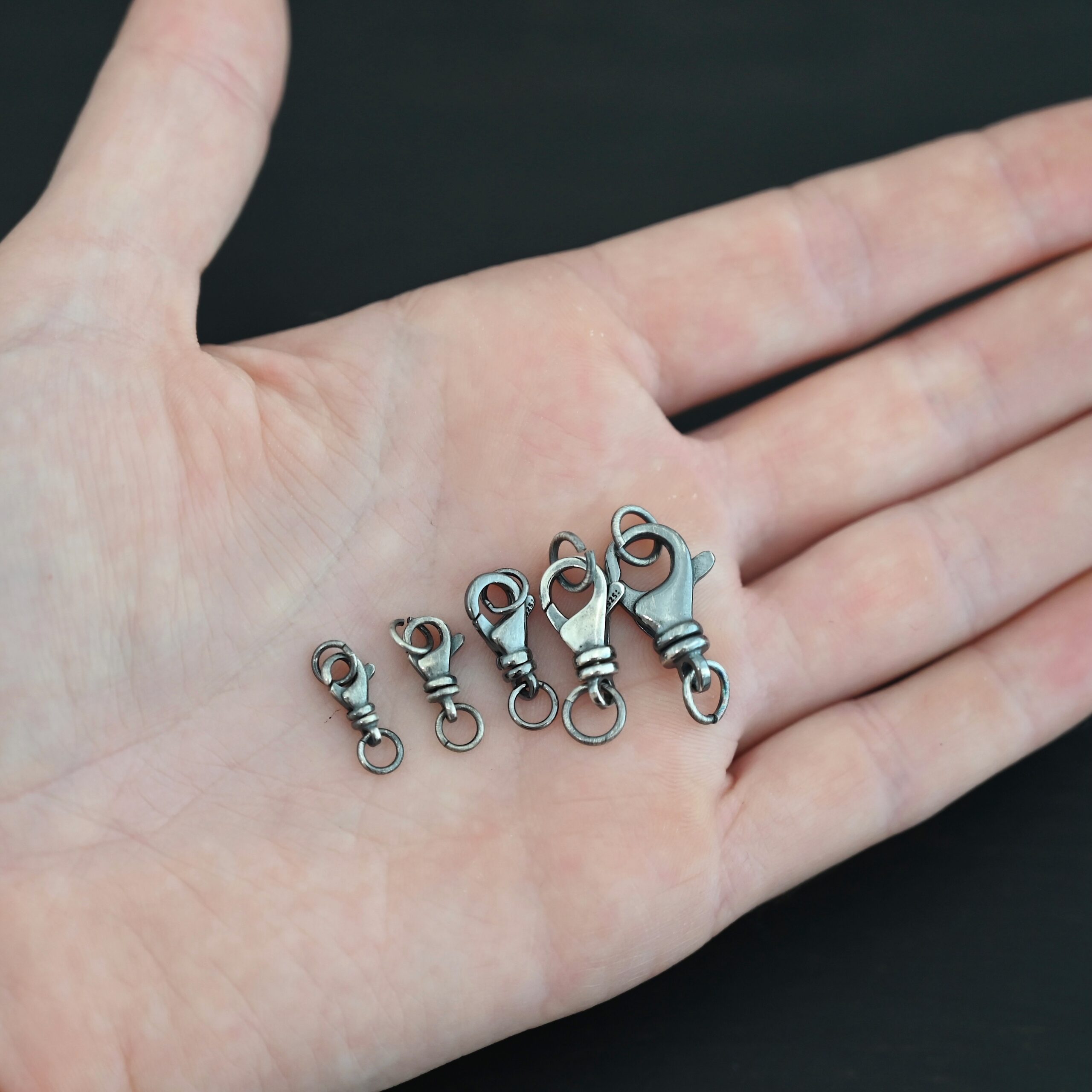 Sammy Swivel Lobster Claw - oxidized closed shown in hand