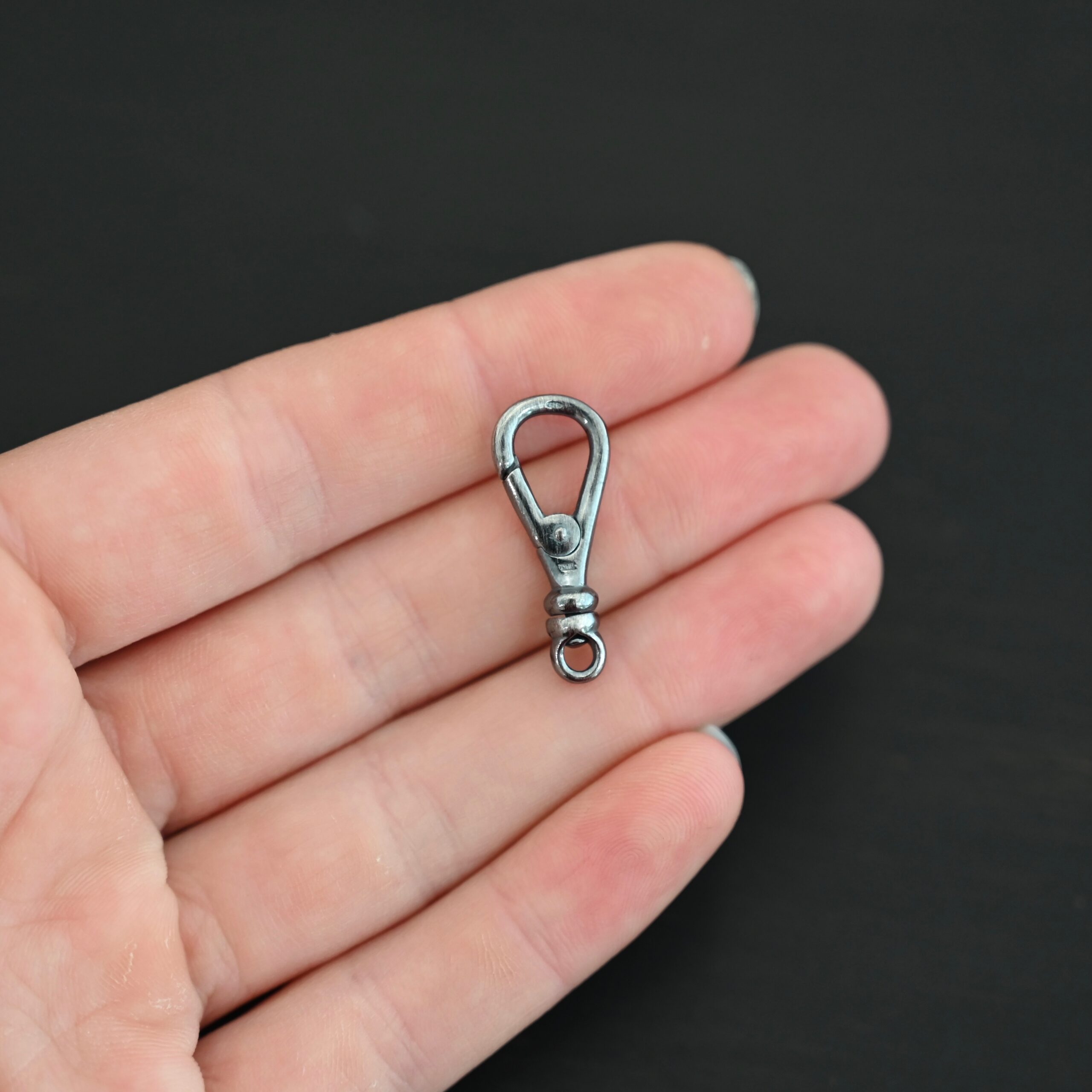 Sage Swivel Lobster Claw Clasp - 27mm oxidized shown in hand