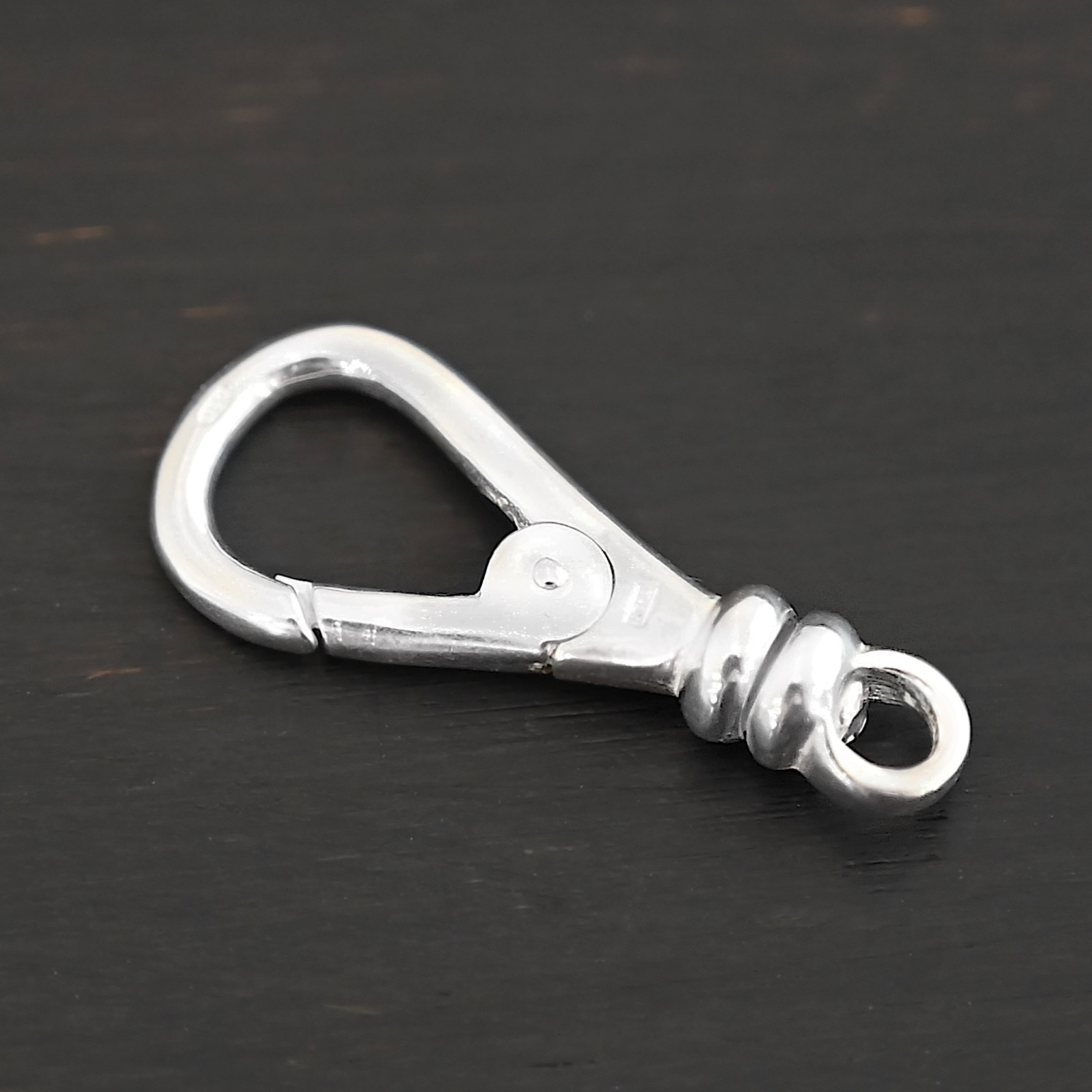 Sage Swivel Lobster Claw Clasp - 27mm shiny shown on dark background