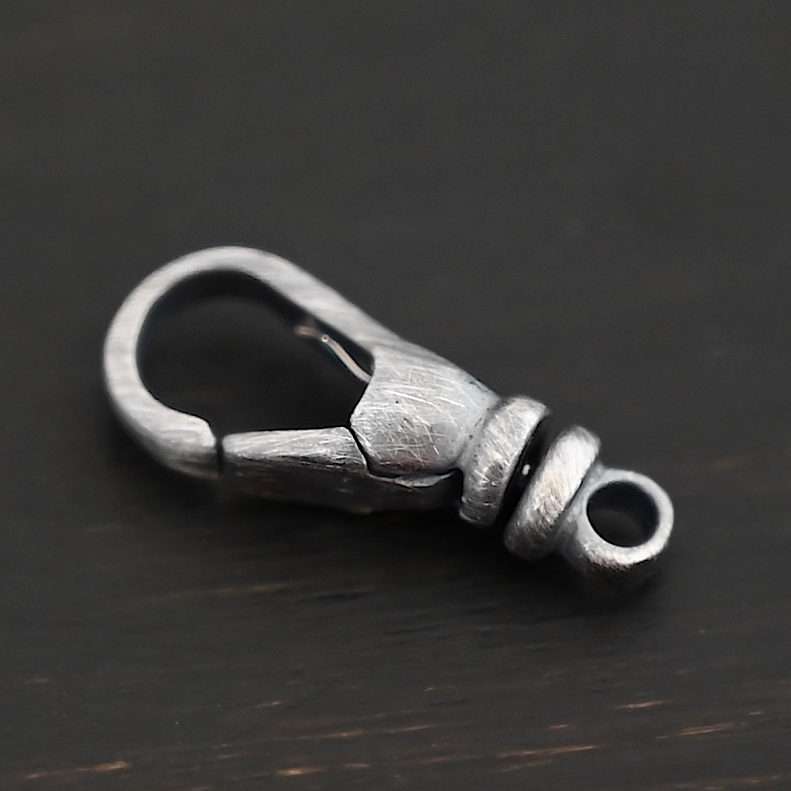 Sage Swivel Lobster Claw Clasp - 16mm oxidized shown on dark background