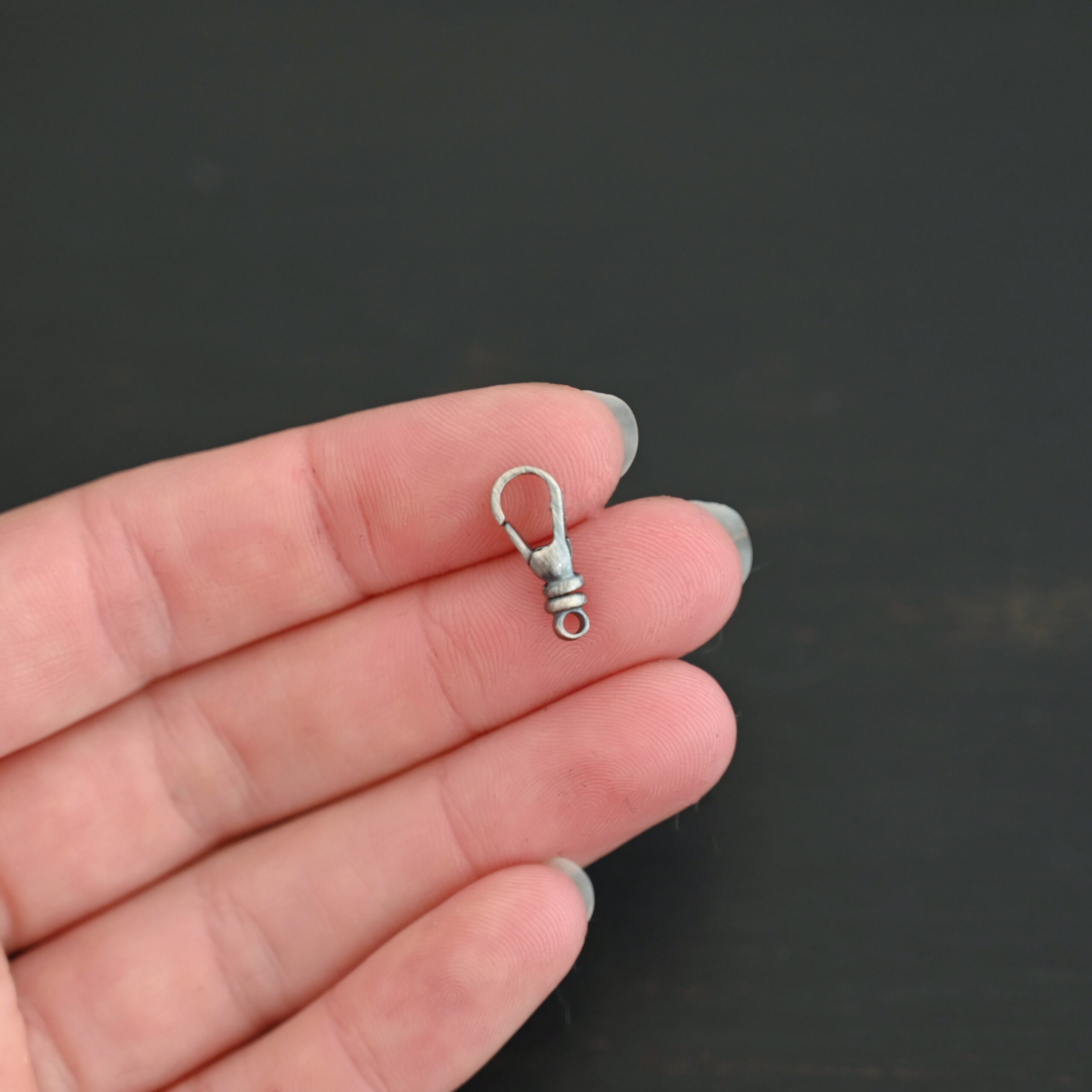 Sage Swivel Lobster Claw Clasp - 16mm oxidized shown in hand