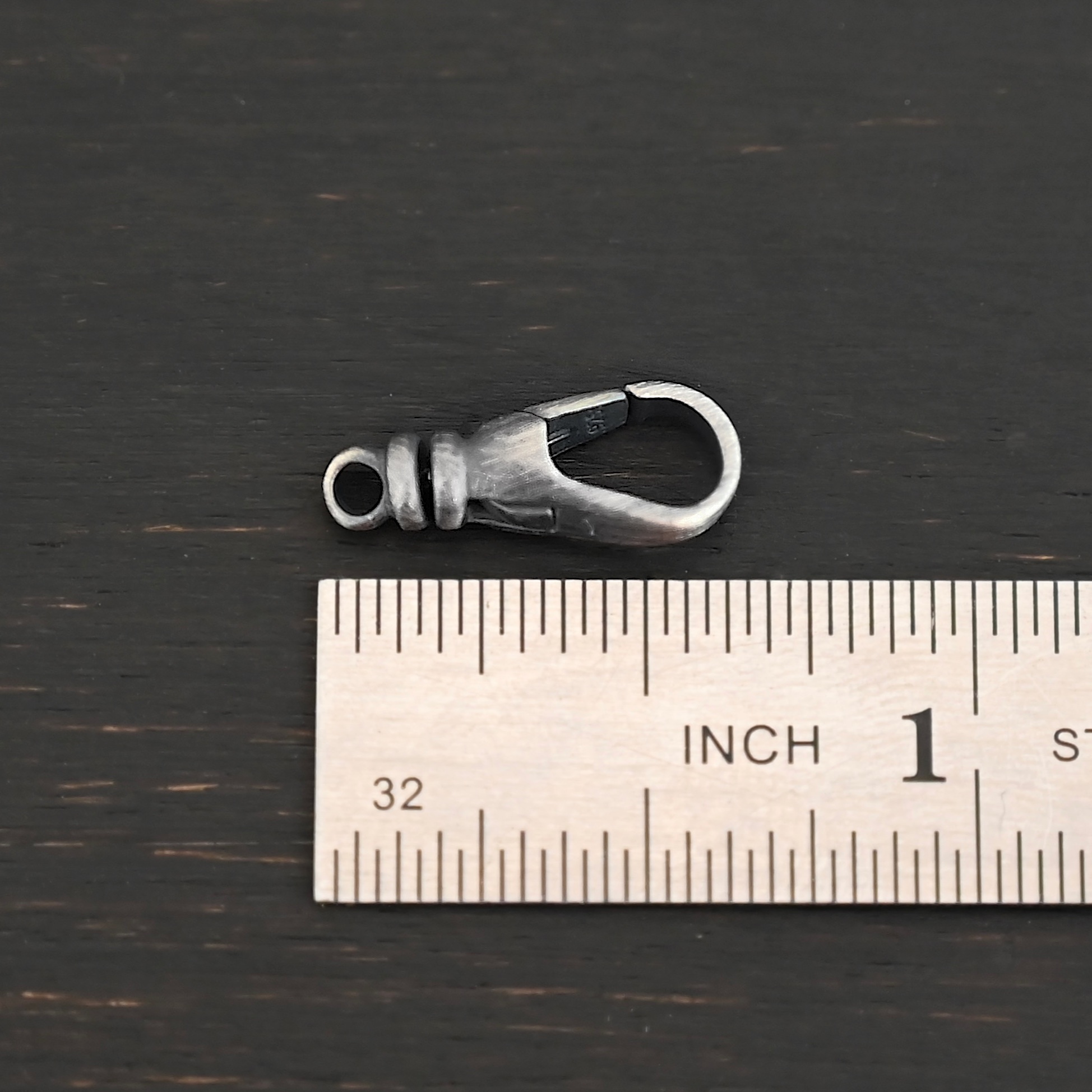 Sage Swivel Lobster Claw Clasp - 16mm oxidized shown by ruler