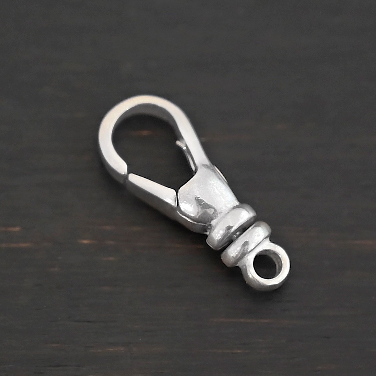 Sage Swivel Lobster Claw Clasp - 16mm shiny shown on dark background