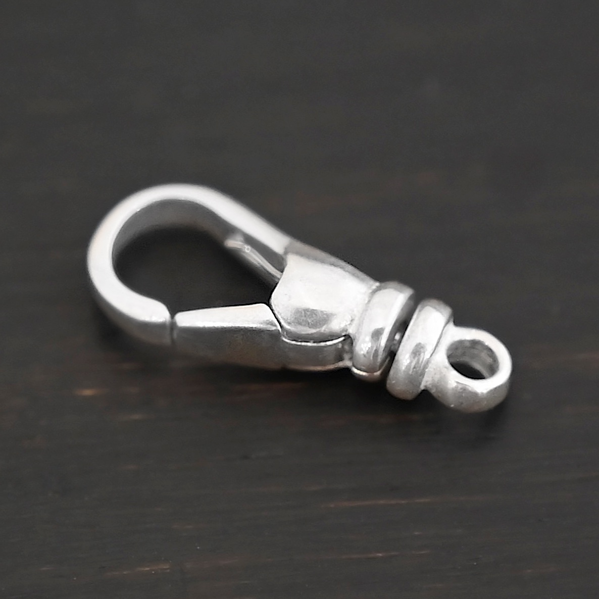 Sage Swivel Lobster Claw Clasp - 16mm shiny shown on dark background