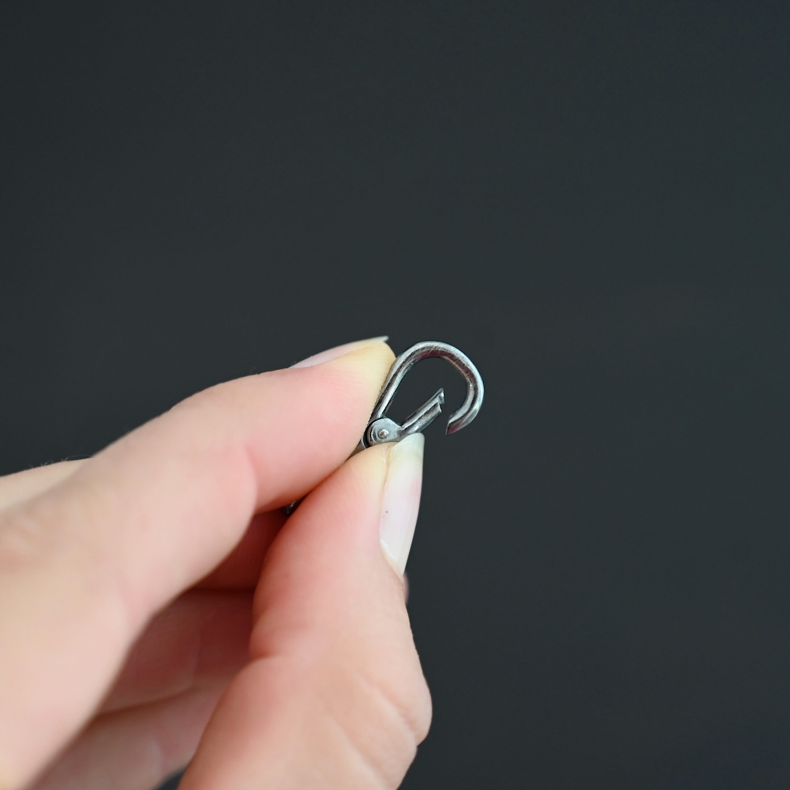 Sage Swivel Lobster Claw Clasp - 27mm oxidized shown in hand