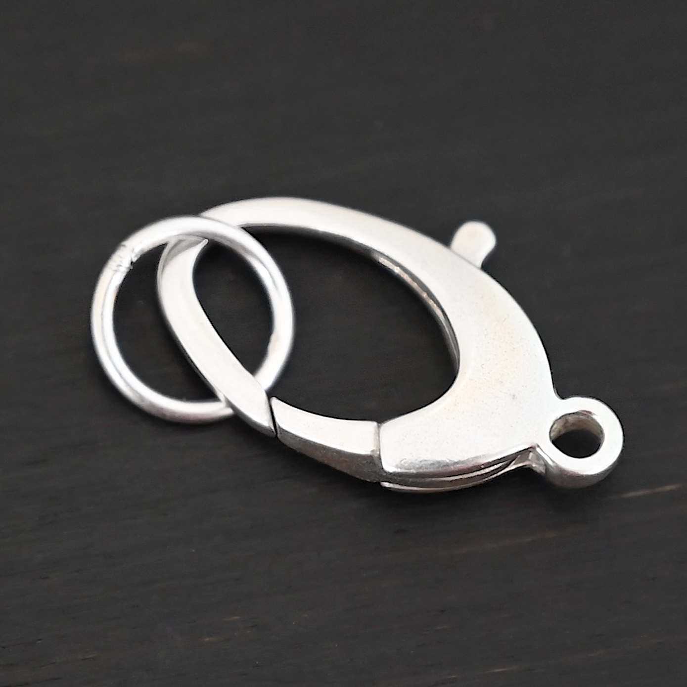 Luna Lobster Claw Clasp with JR - shiny shown on dark background