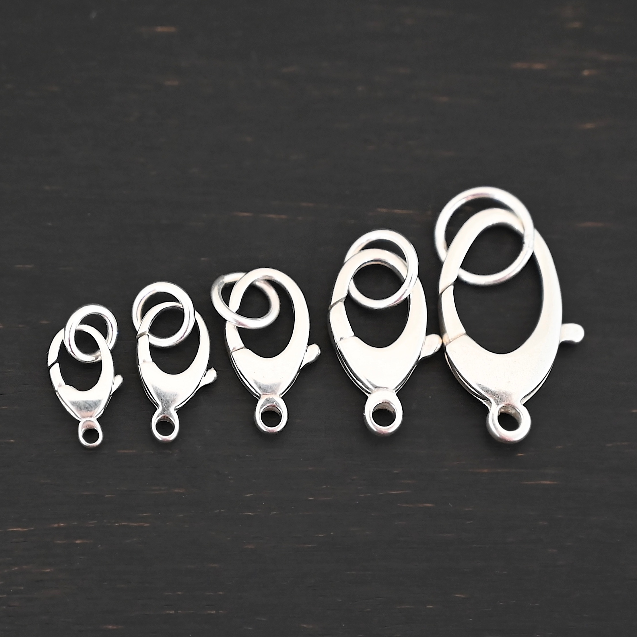 Luna Lobster Claw Clasp with JR - shiny shown on dark background