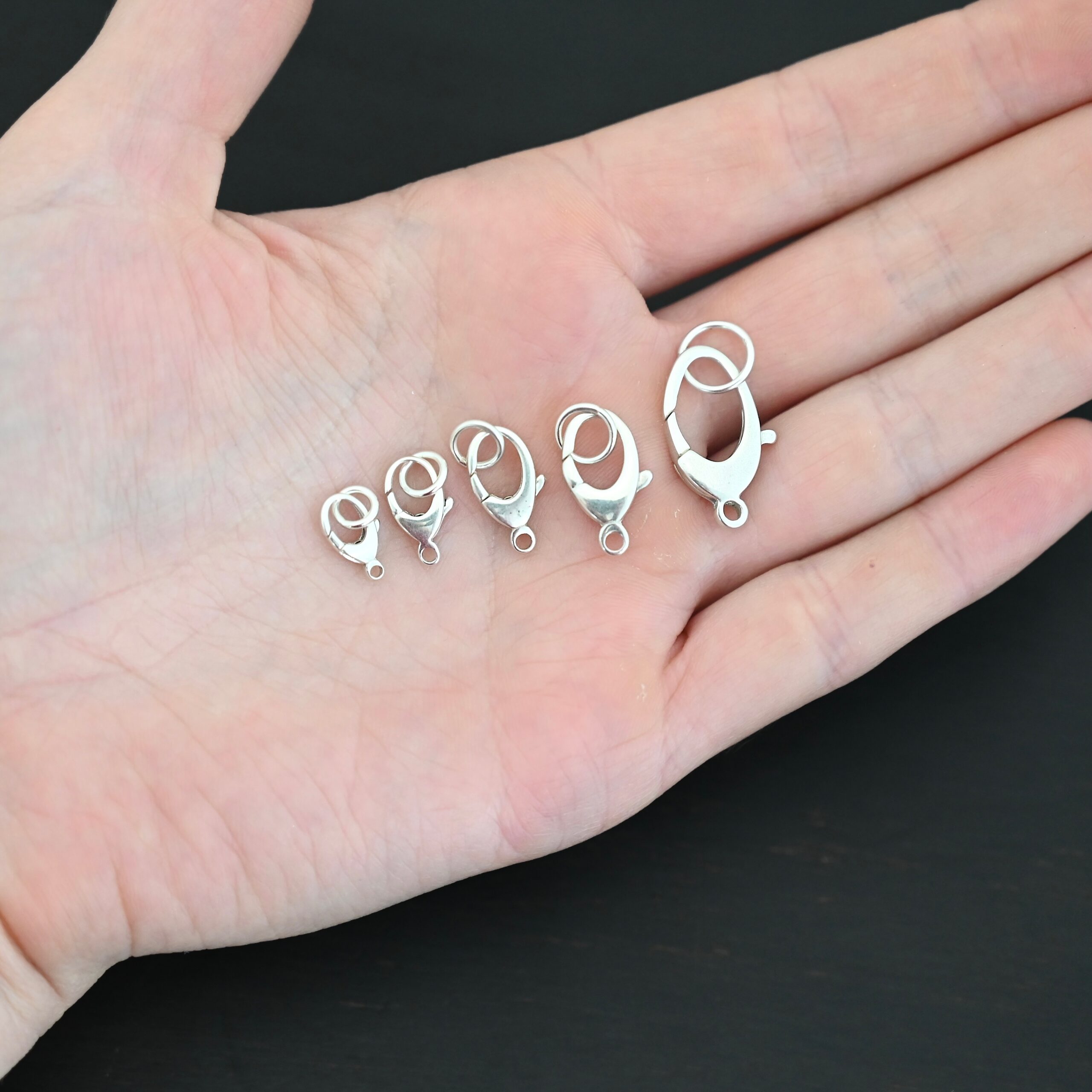 Luna Lobster Claw Clasp with JR - shiny shown in hand