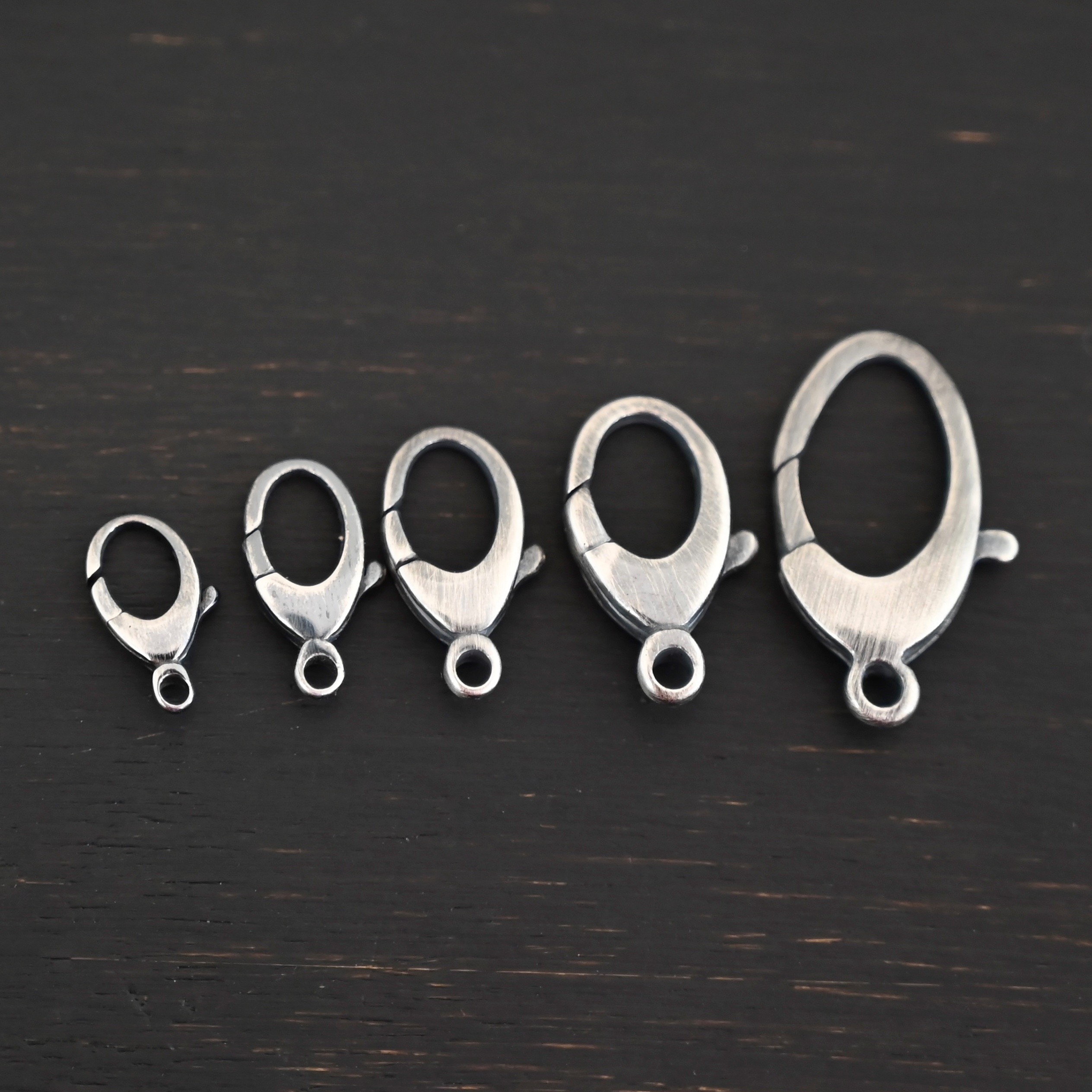 Luna Lobster Claw Clasp - oxidized shown on dark background