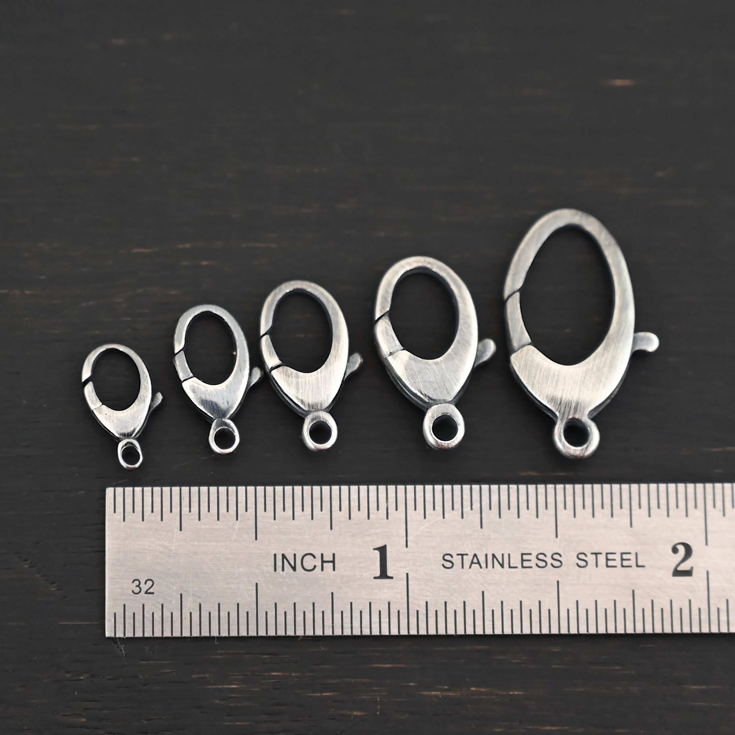 Luna Lobster Claw Clasp - oxidized shown by ruler