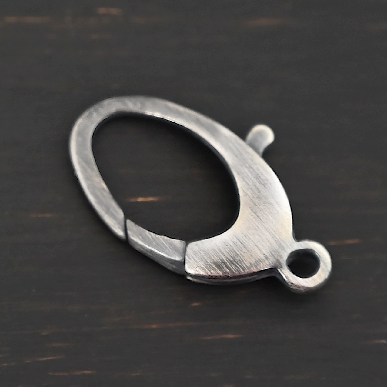 Luna Lobster Claw Clasp - oxidized shown in hand