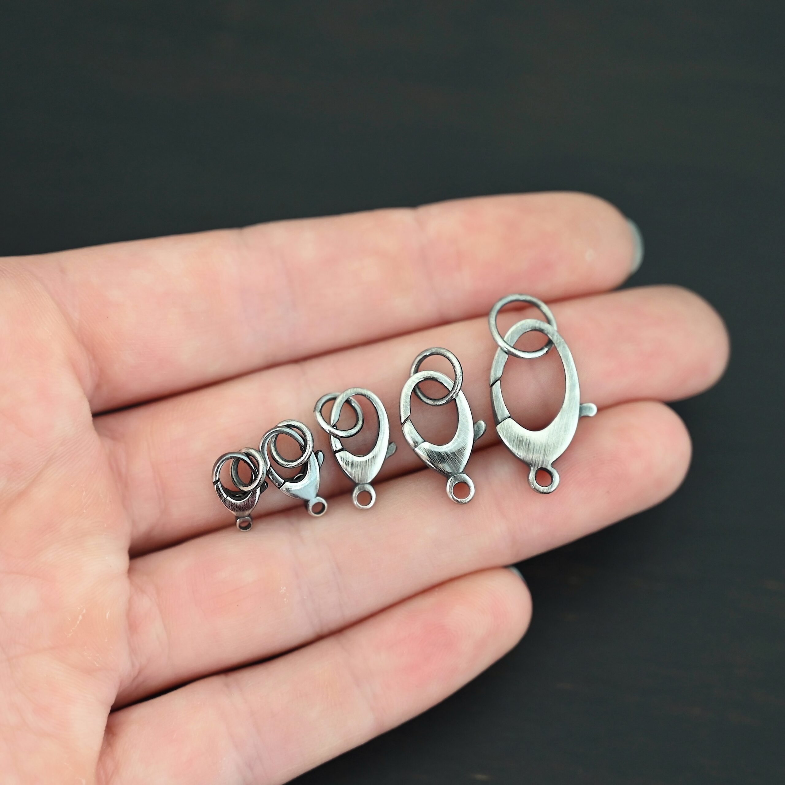 Luna Lobster Claw Clasp with JR - oxidized shown in hand