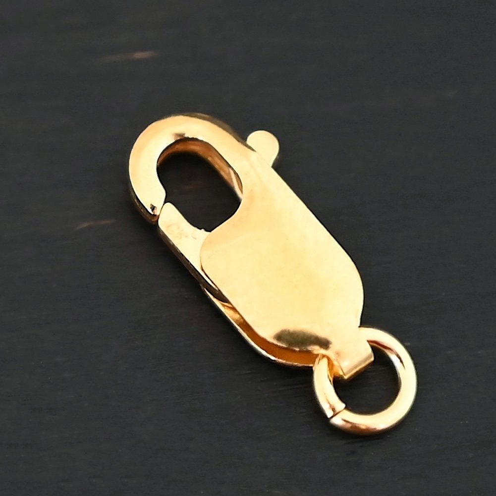 Lacey 14k gold filled Lobster Claw Clasp shown on dark background
