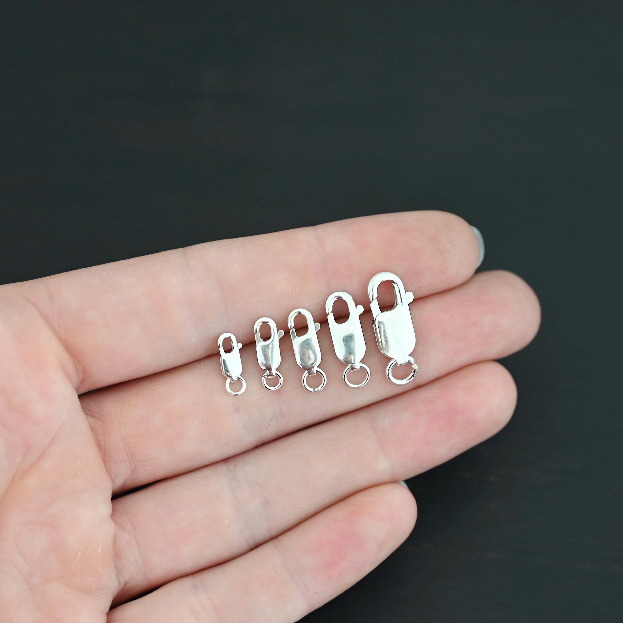 Lennon Lobster Claw - shiny shown in hand