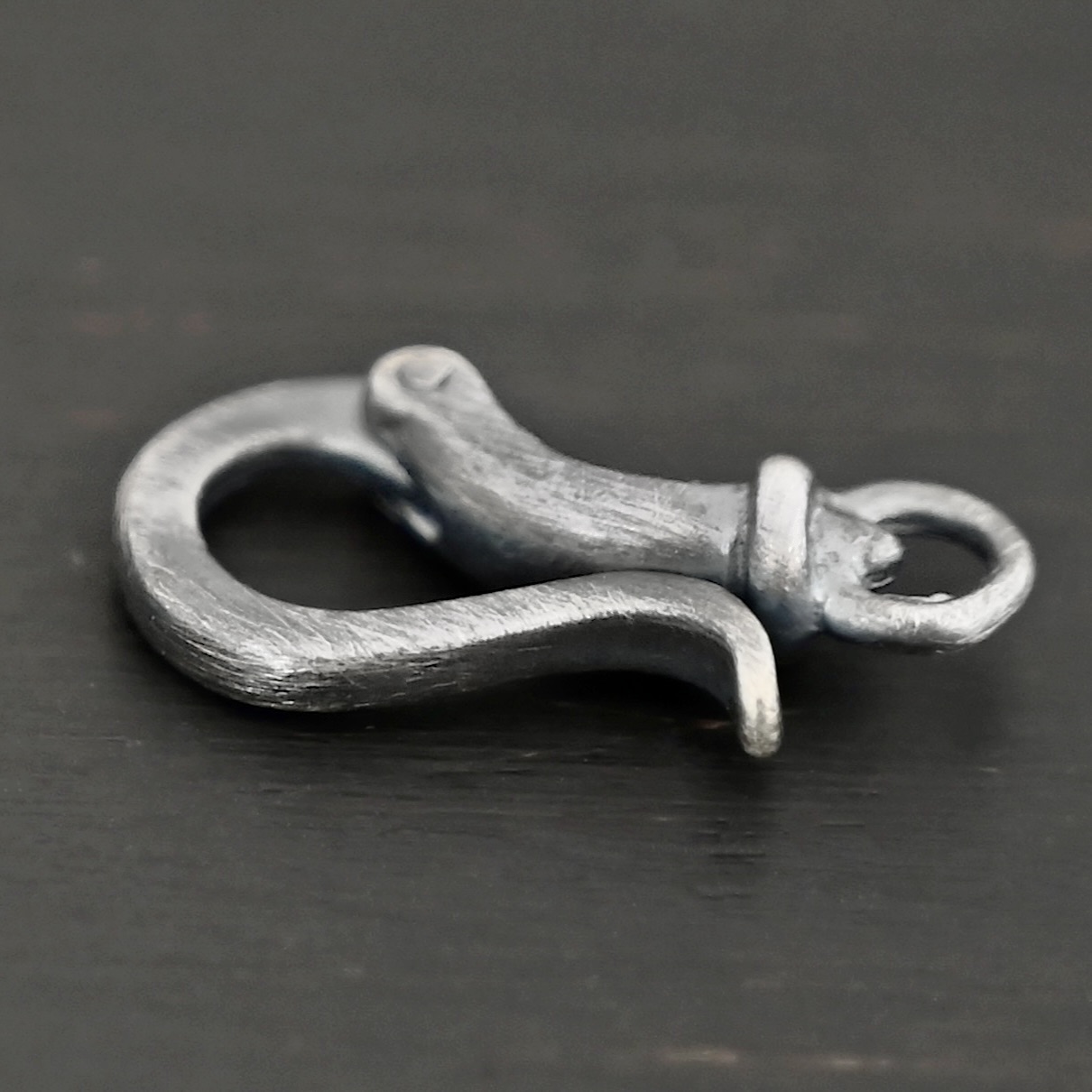 Henry Hook Clasp - oxidized shown on dark background