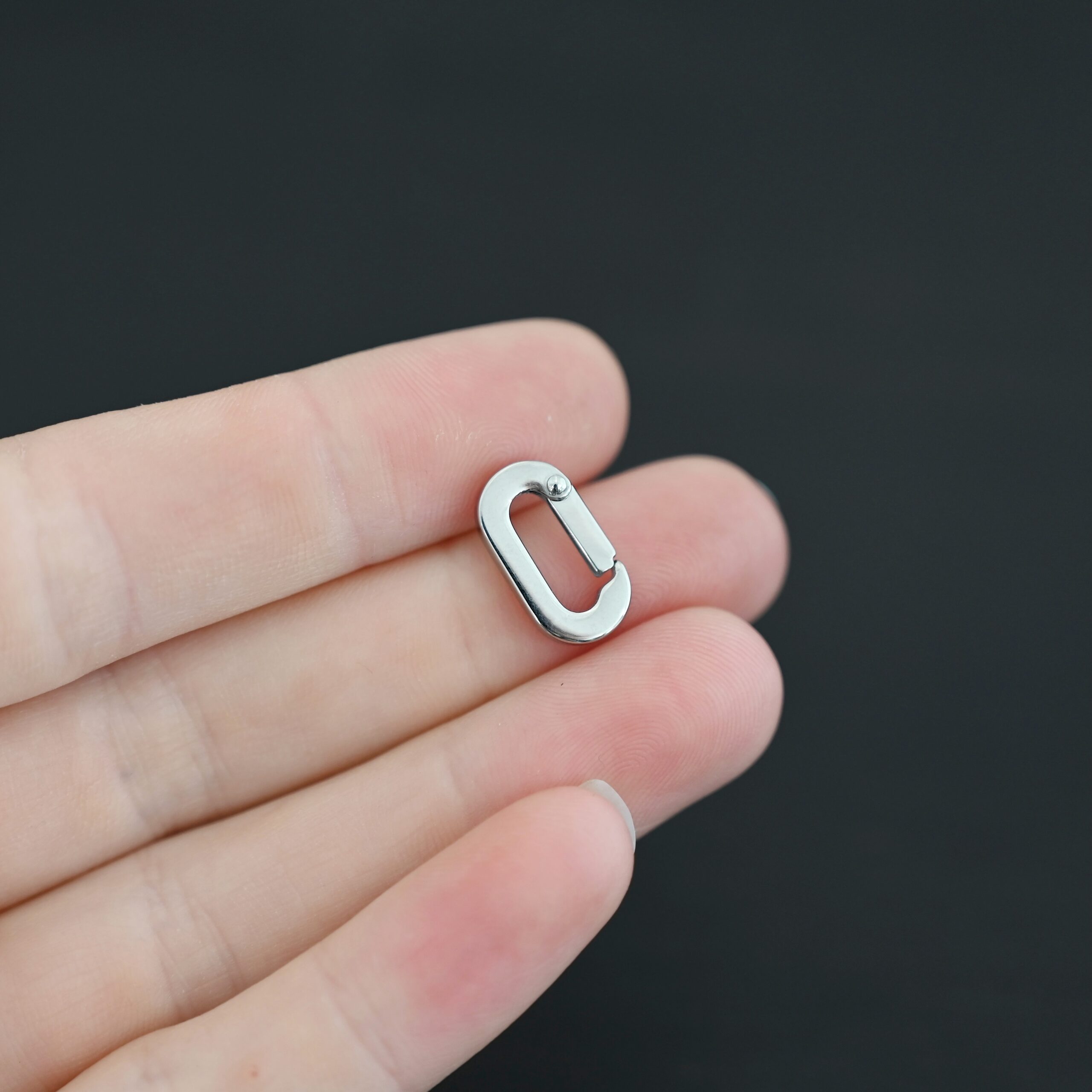 Perry Stainless Oval Clasp Perry Stainless Oval Clasp shown in hand