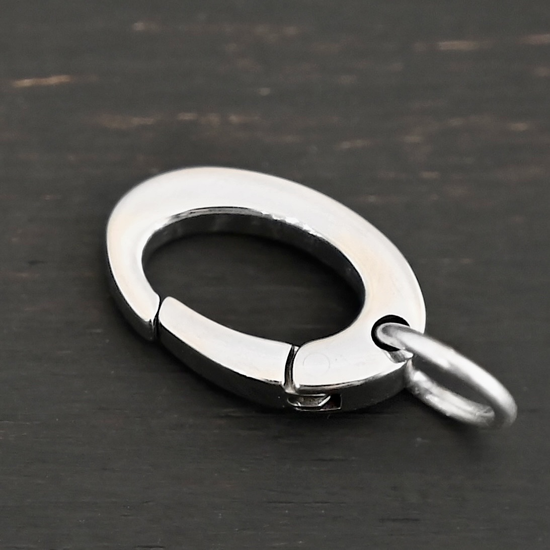 Paul Stainless Oval Clasp Paul Stainless Oval Clasp shown on dark background