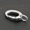 Paul Stainless Oval Clasp shown on dark background