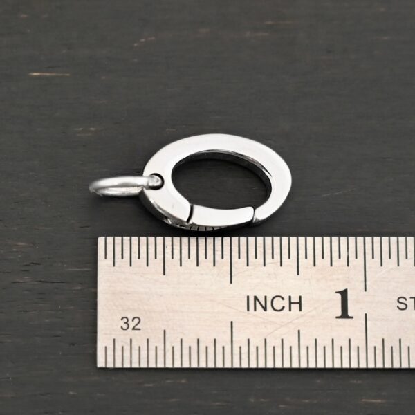 Paul Stainless Oval Clasp shown by ruler