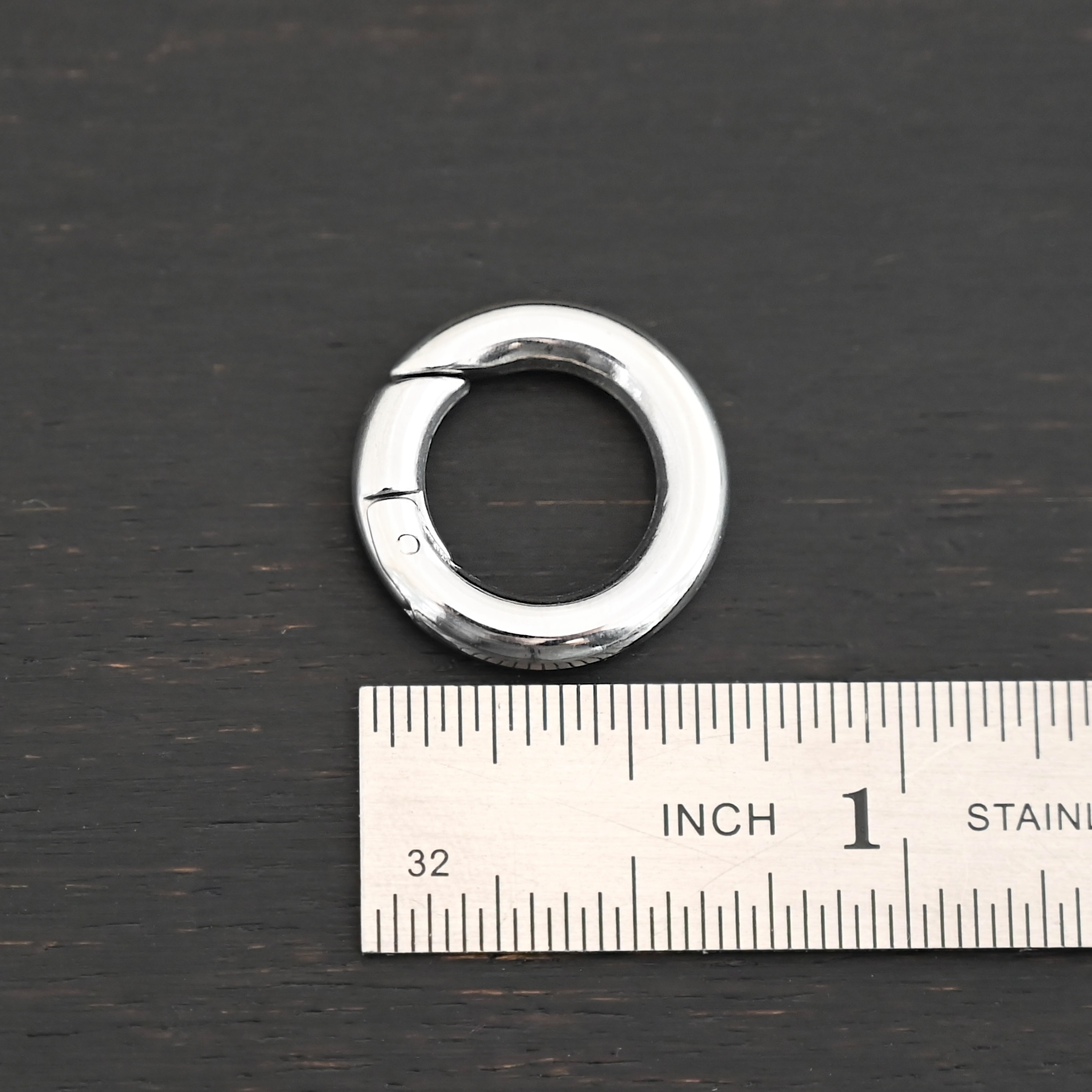 Pheonix Stainless Oval Clasp - 18mm shown by ruler