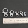 Faith Figure Eight Clasp - oxidized shown by ruler