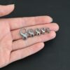 Faith Figure Eight Clasp - oxidized shown in hand