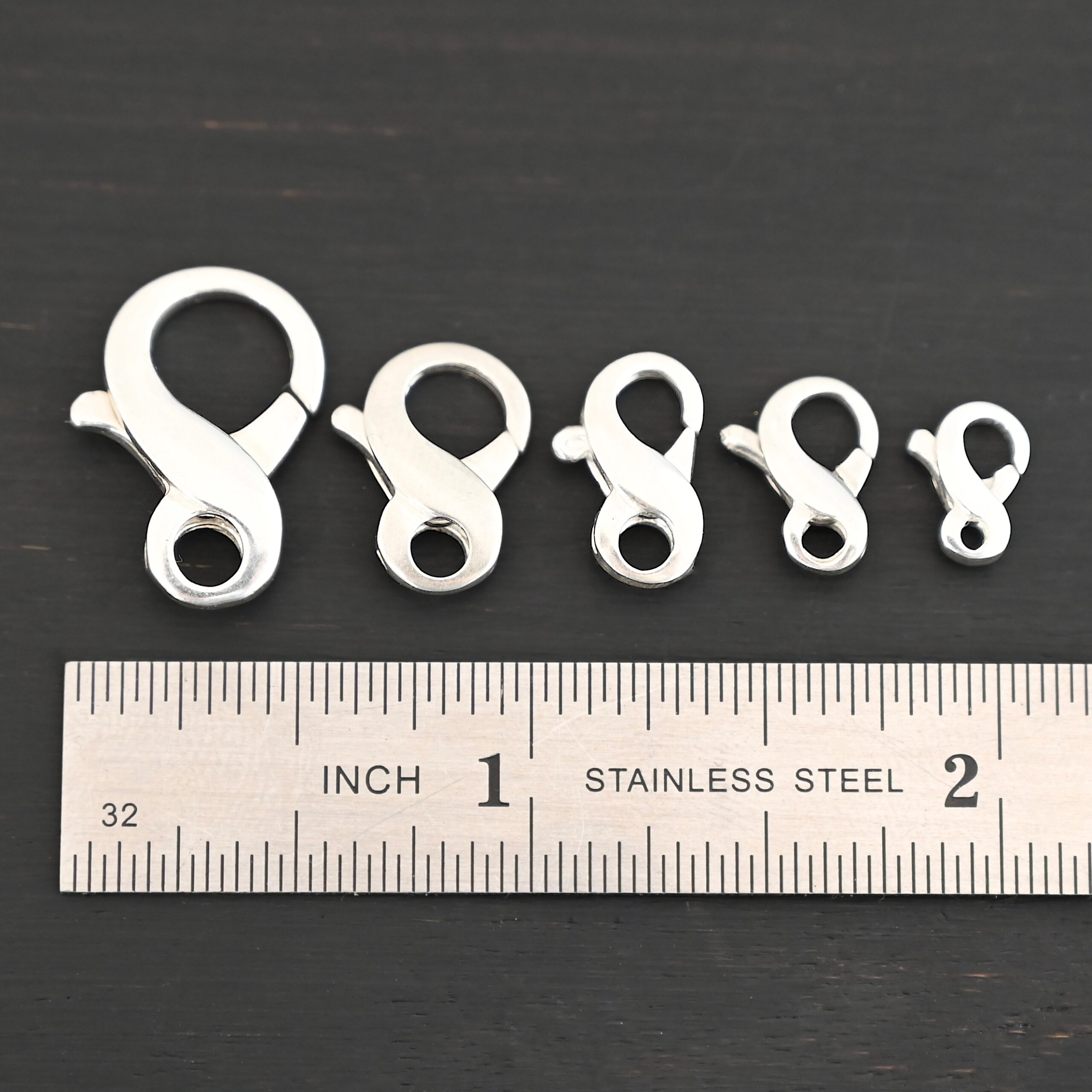 DSC_8414 Faith Figure Eight Clasp - shiny shown by ruler