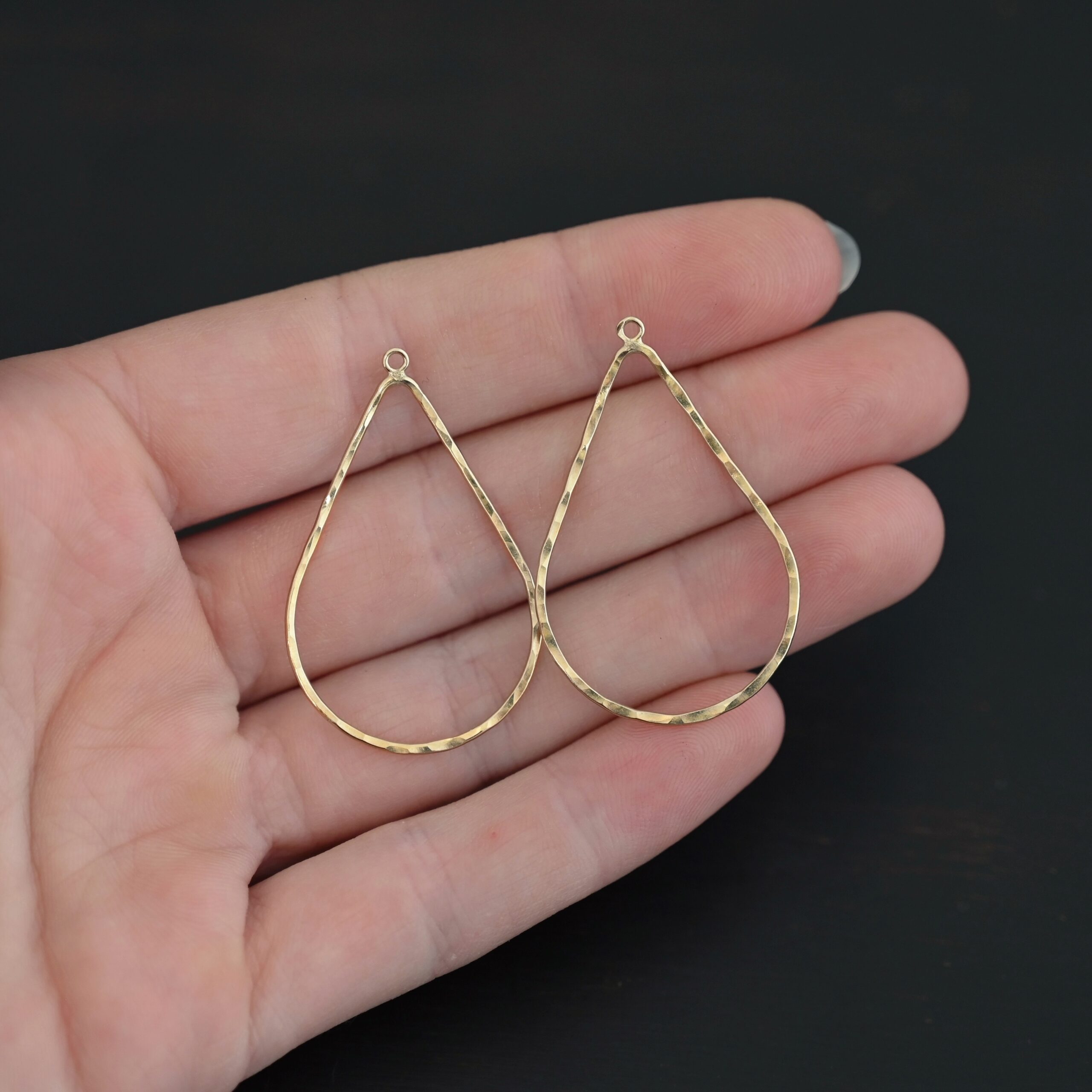 Talia - 14k gold filled Teardrop Chandelier - 38x25mm hammered shown in hand