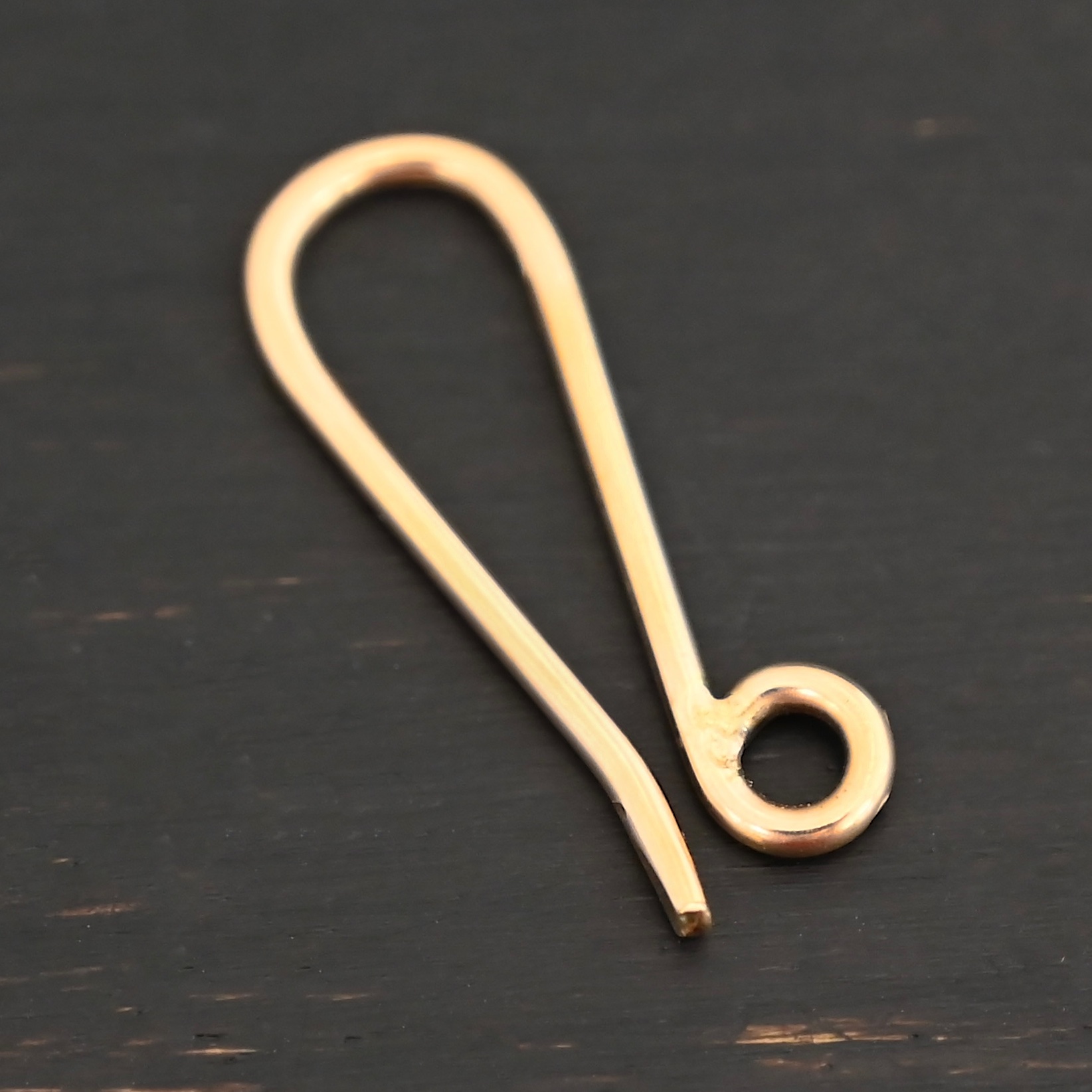 Heidi 14k gold filled hook clasp shown on dark background