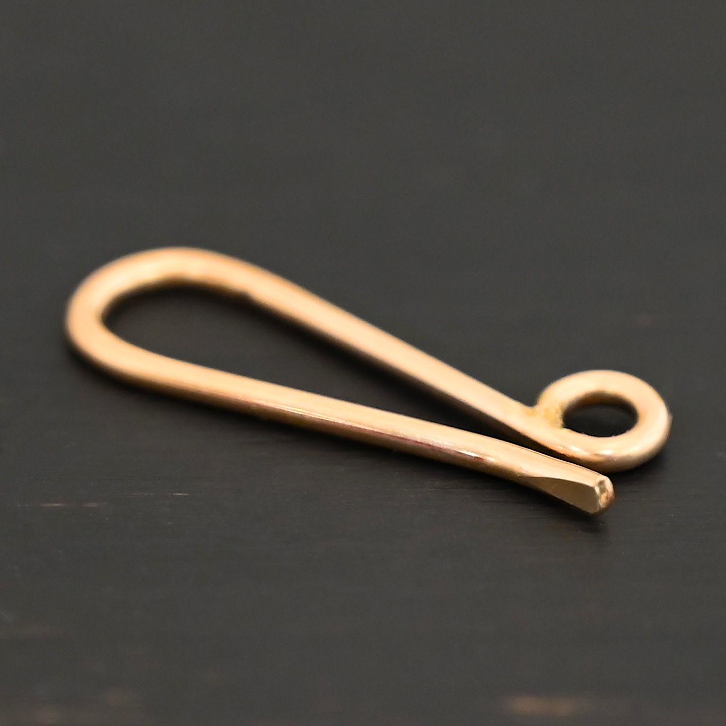 Heidi 14k gold filled hook clasp shown on dark background