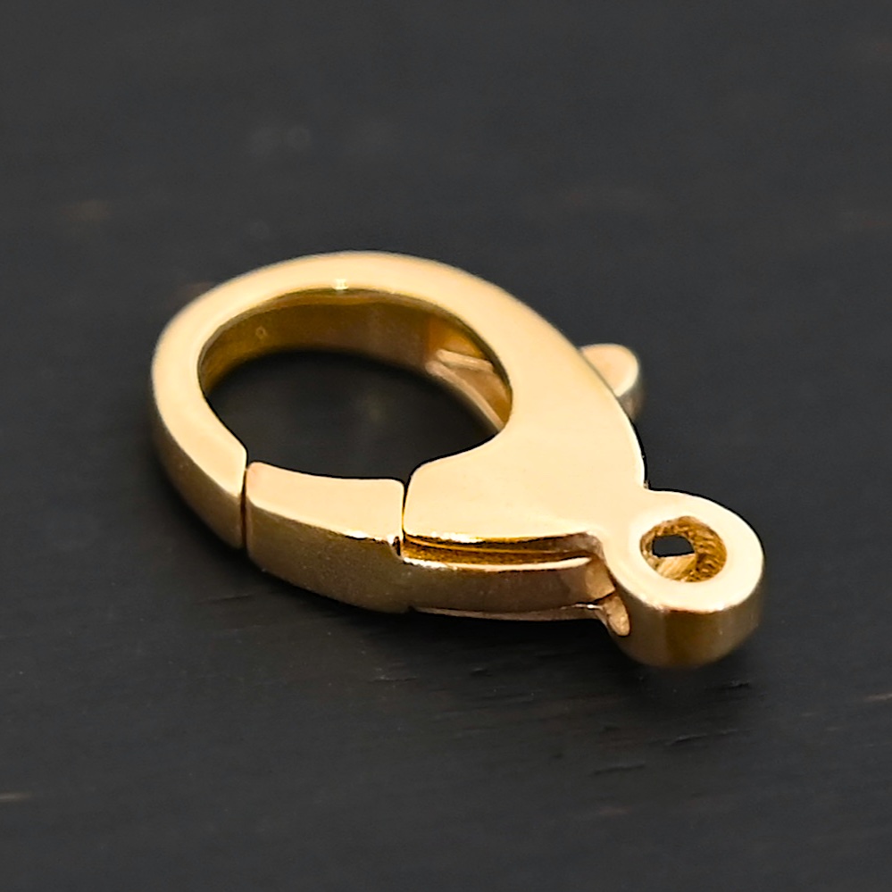 Lily 14k gold filled lobster claw clasp shown on dark background