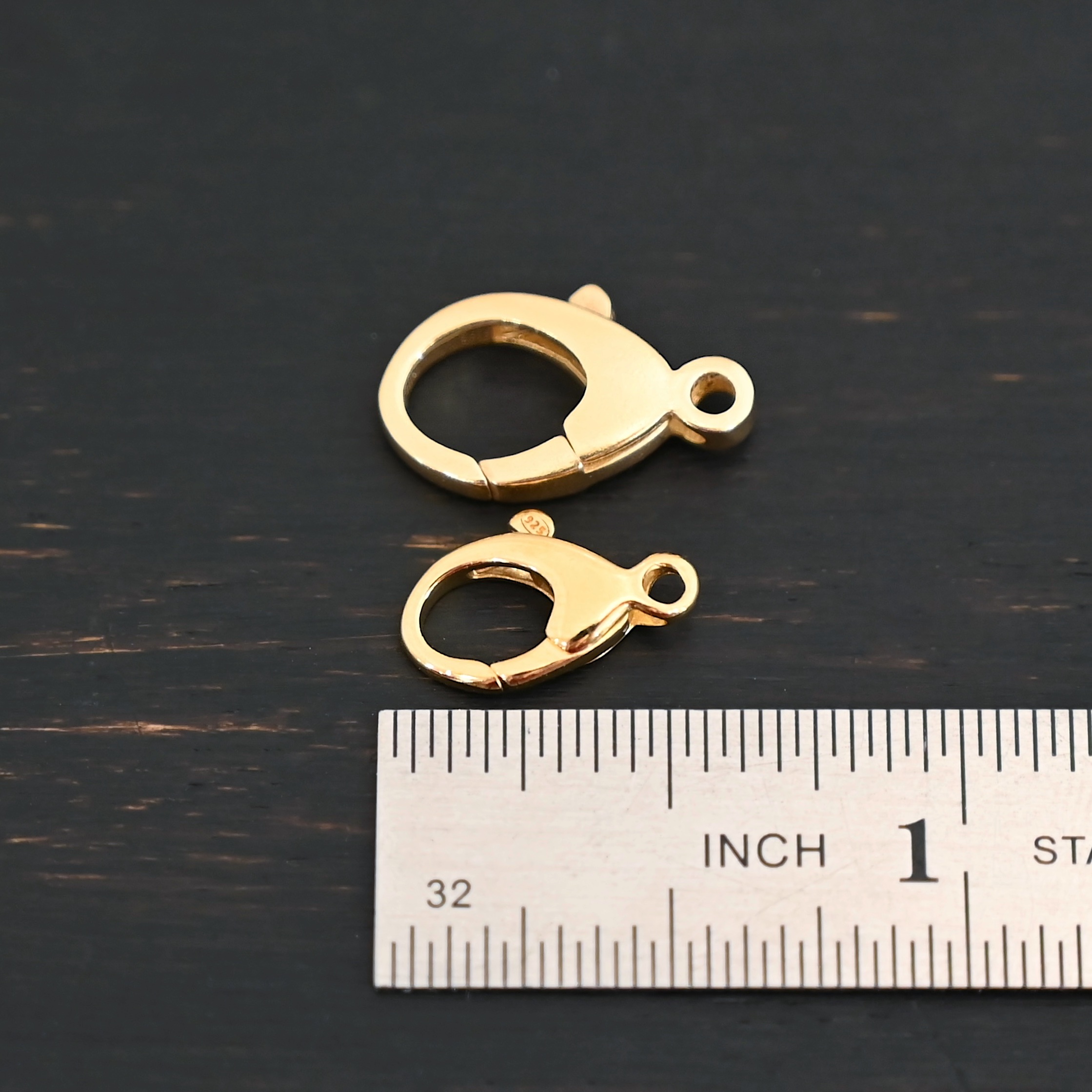 Lily 14k gold filled lobster claw clasp - shown by ruler