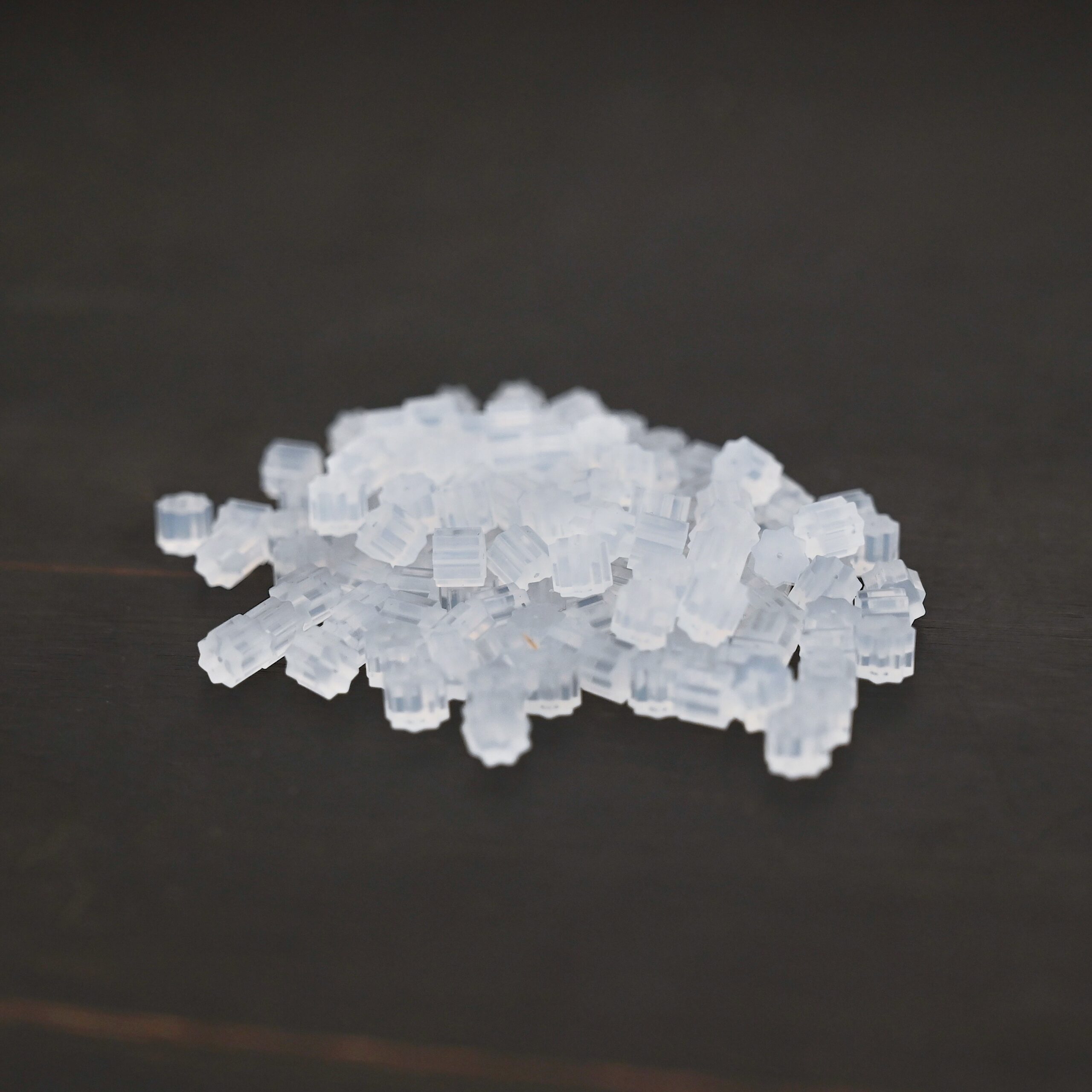 Rubber Earring Backs shown on dark background