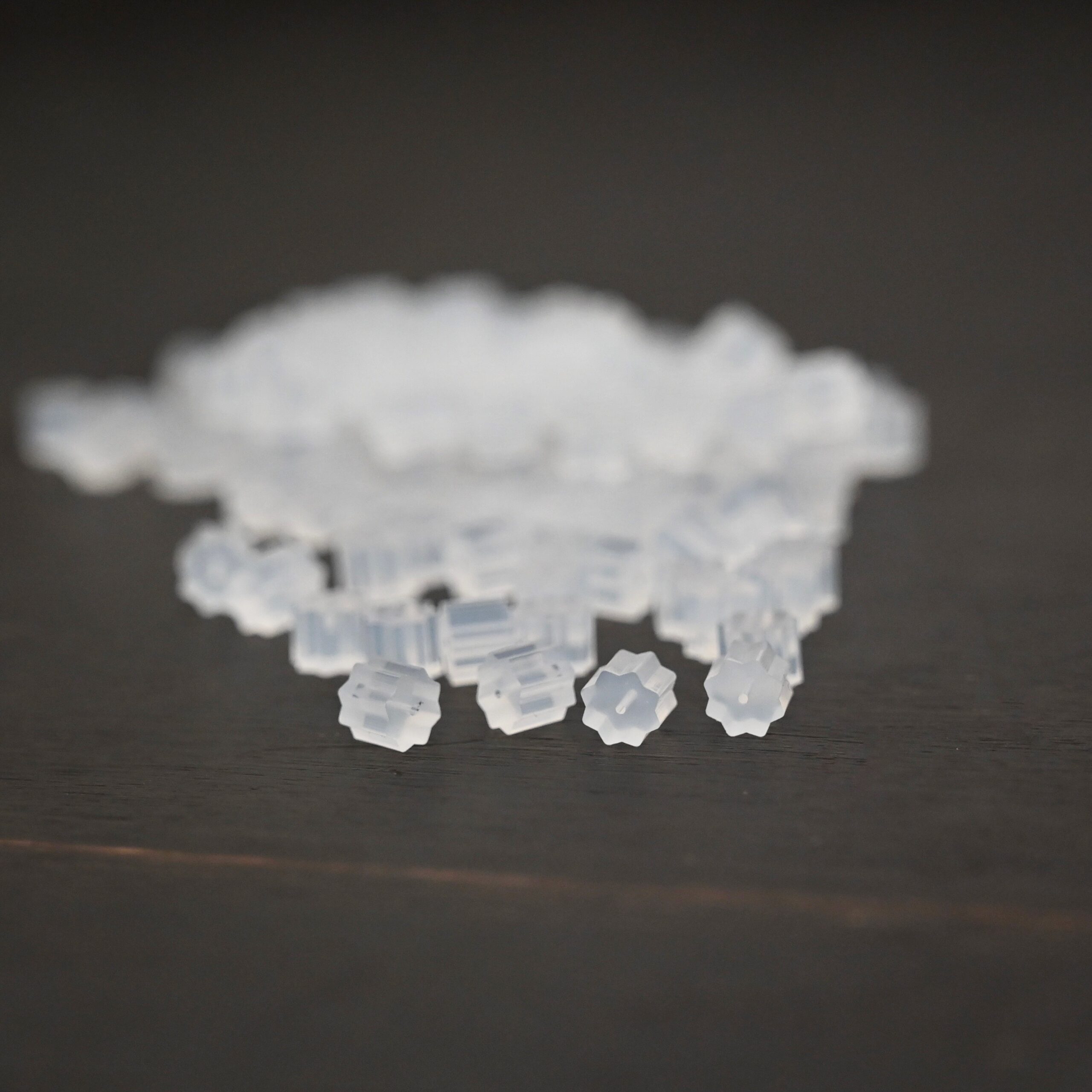 Rubber Earring Backs shown on dark background