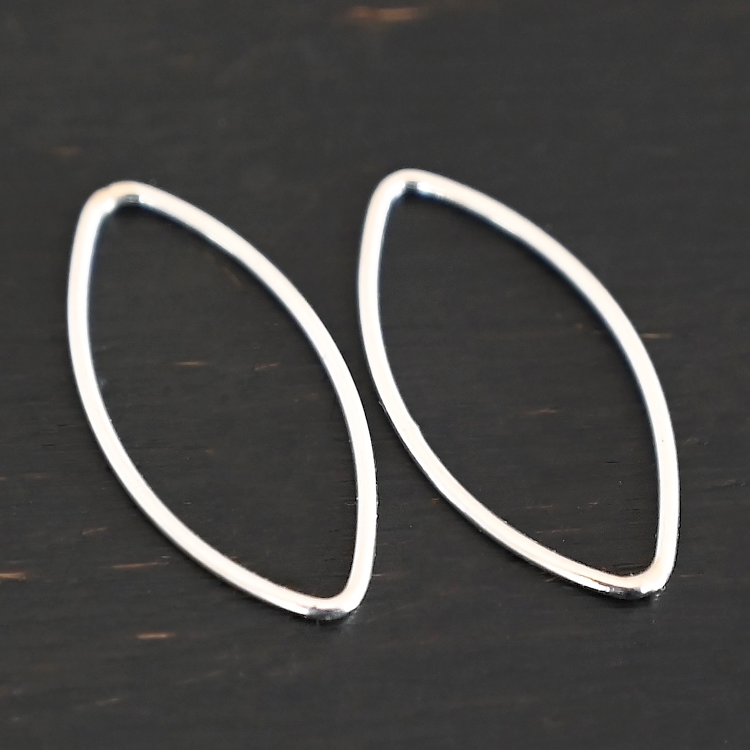 Tanya Marquise Chandelier shiny smooth 20x9mm Sterling Silver Tanya Marquise Chandelier shiny smooth 20x9mm shown on dark background