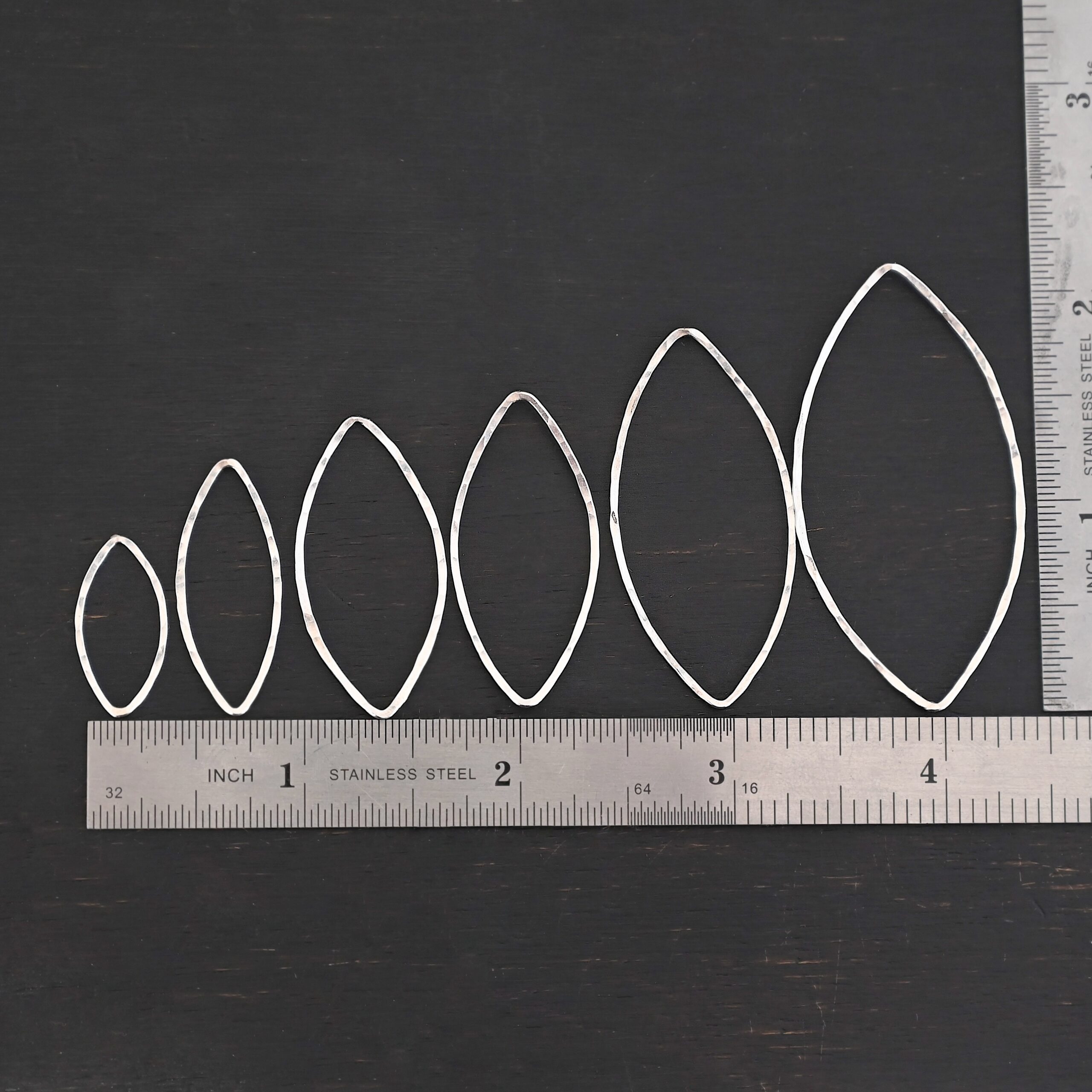 Tanya Marquise Chandelier shiny hammered Sterling Silver Tanya Marquise Chandelier shiny hammered all sizes shown by ruler