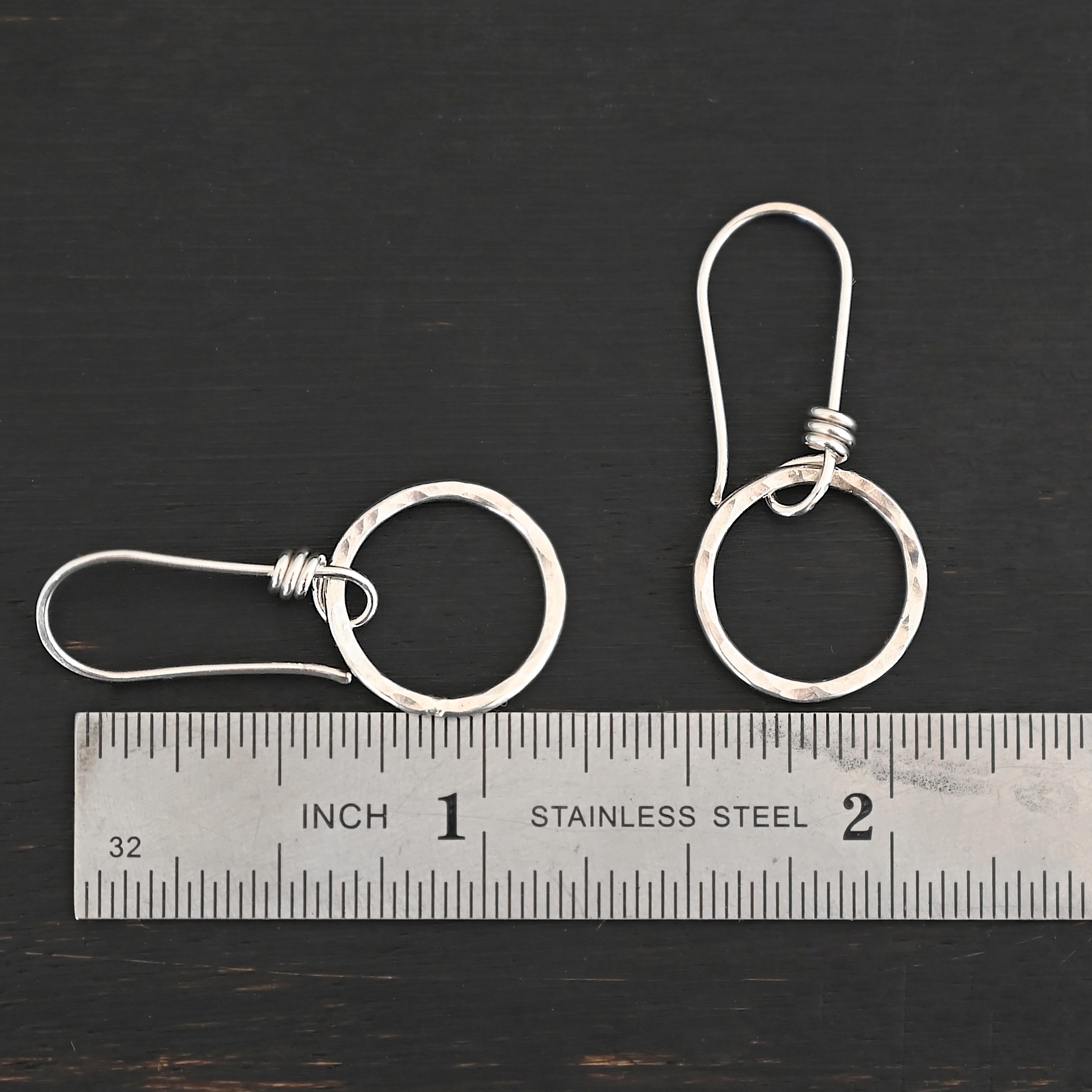 Sterling Silver Flora Hammered Circle Earrings shiny shown by ruler