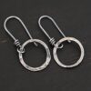 Sterling Silver Flora Hammered Circle Earrings oxidized shown on dark background