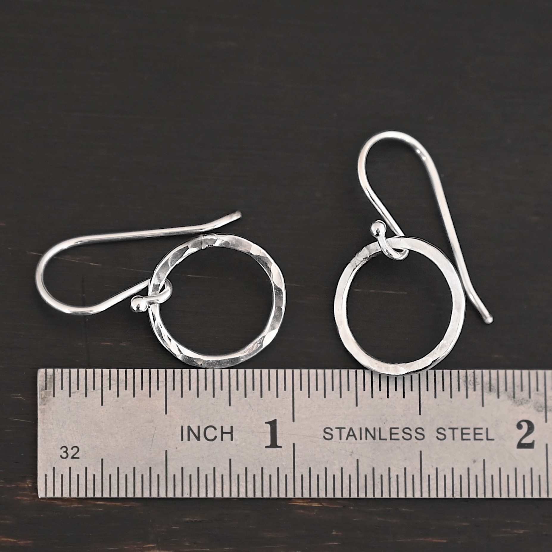 Sterling Silver Fawna Hammered Circle Earrings shiny shown by ruler