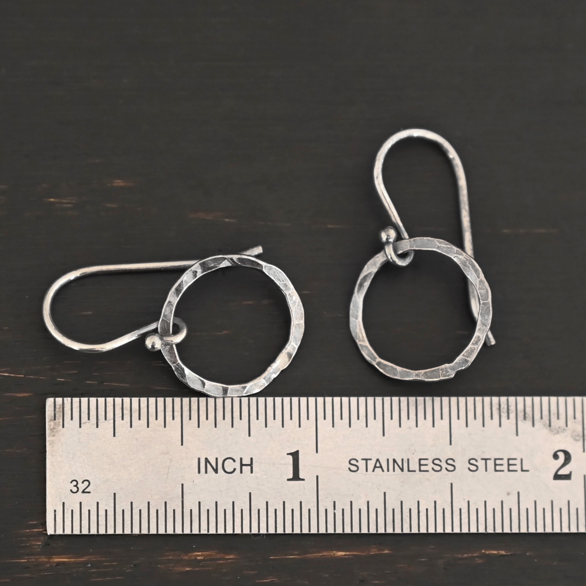 Sterling Silver Fawna Hammered Circle Earrings oxidized shown by ruler