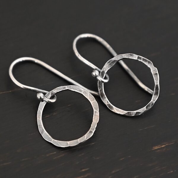 Sterling Silver Fawna Hammered Circle Earrings oxidized shown on dark background