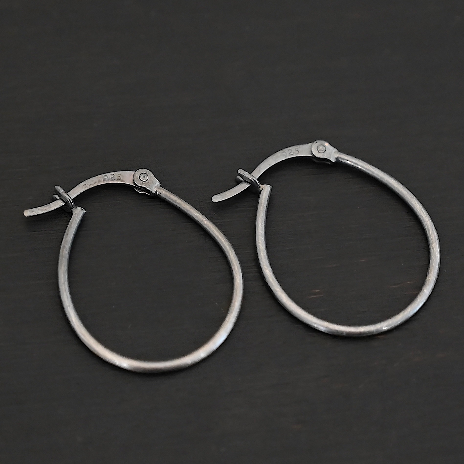 Sterling Silver Fiona Hoop Earrings oxidized shown on dark background