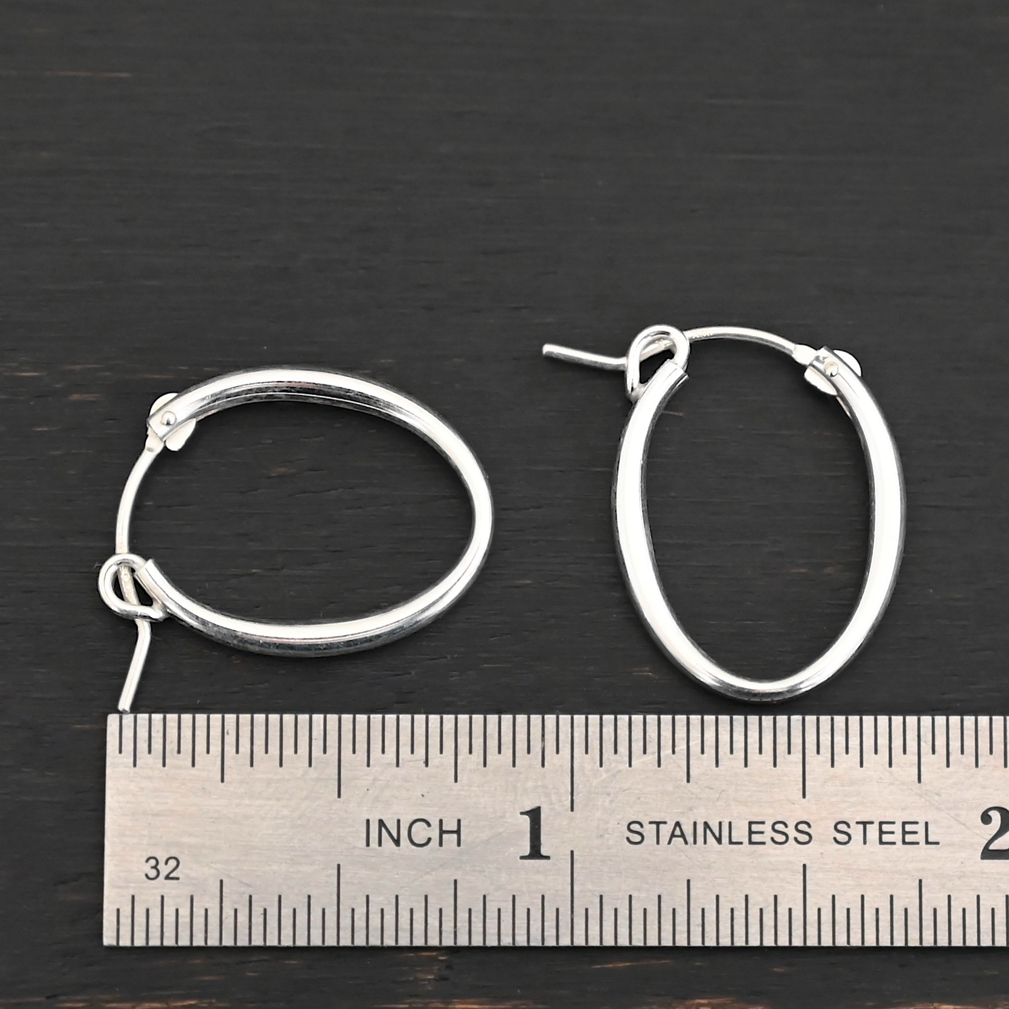 Sterling Silver Frances Oval Hoop Earring 22mm shown by ruler