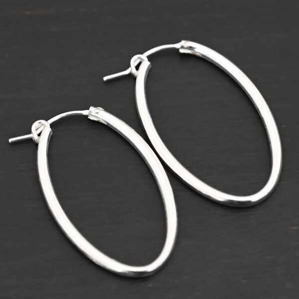 Sterling Silver Frances Oval Hoop Earring 34mm shown on dark background
