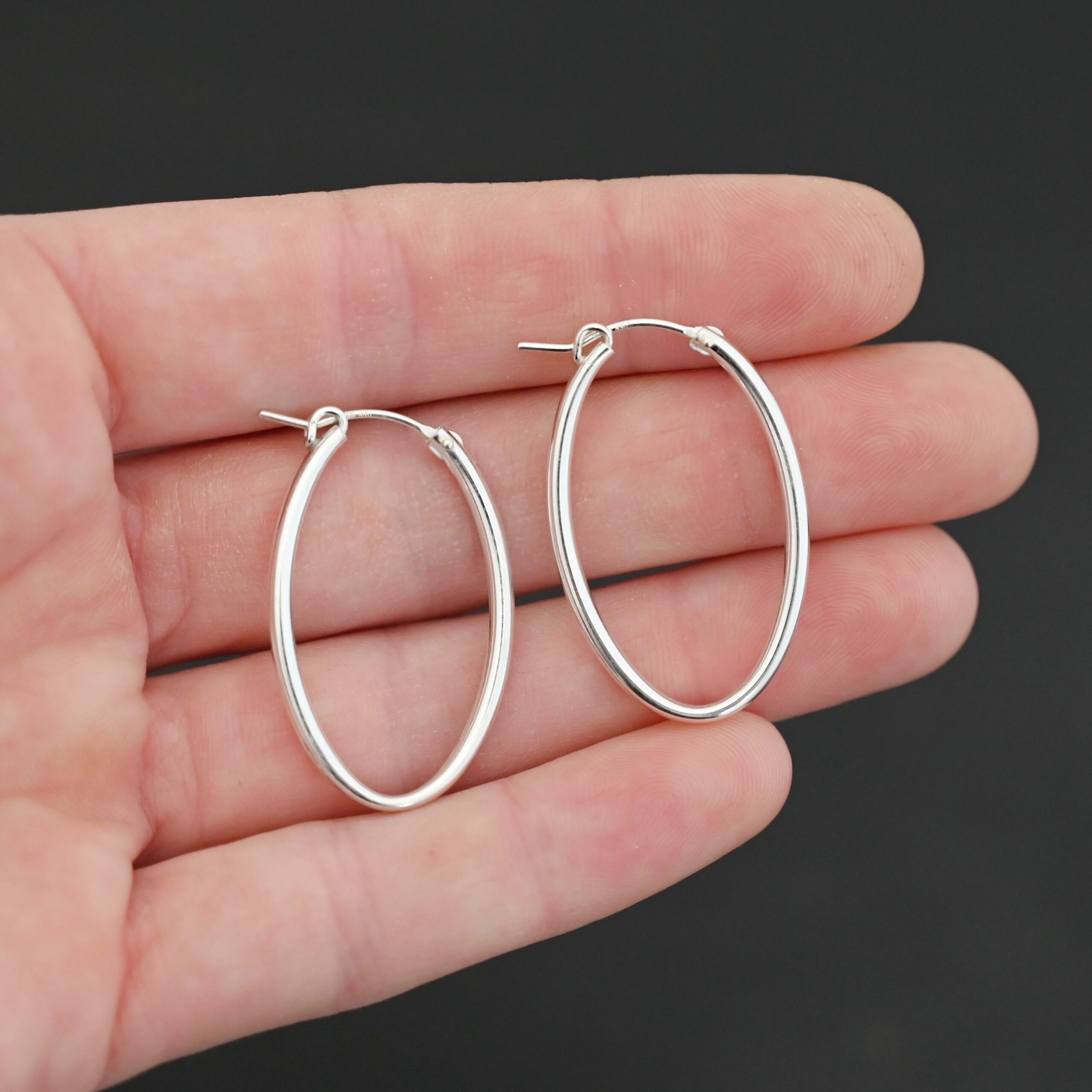 Sterling Silver Frances Oval Hoop Earring 34mm shown in hand