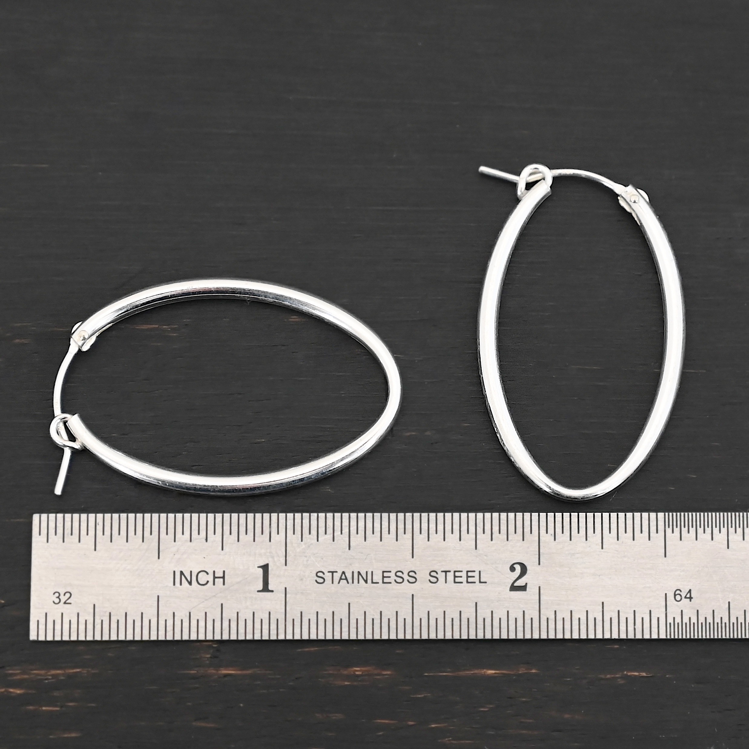 Sterling Silver Frances Oval Hoop Earring 34mm shown by ruler