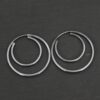 Sterling Silver Fern Double Hoop Earrings oxidized shown on dark background