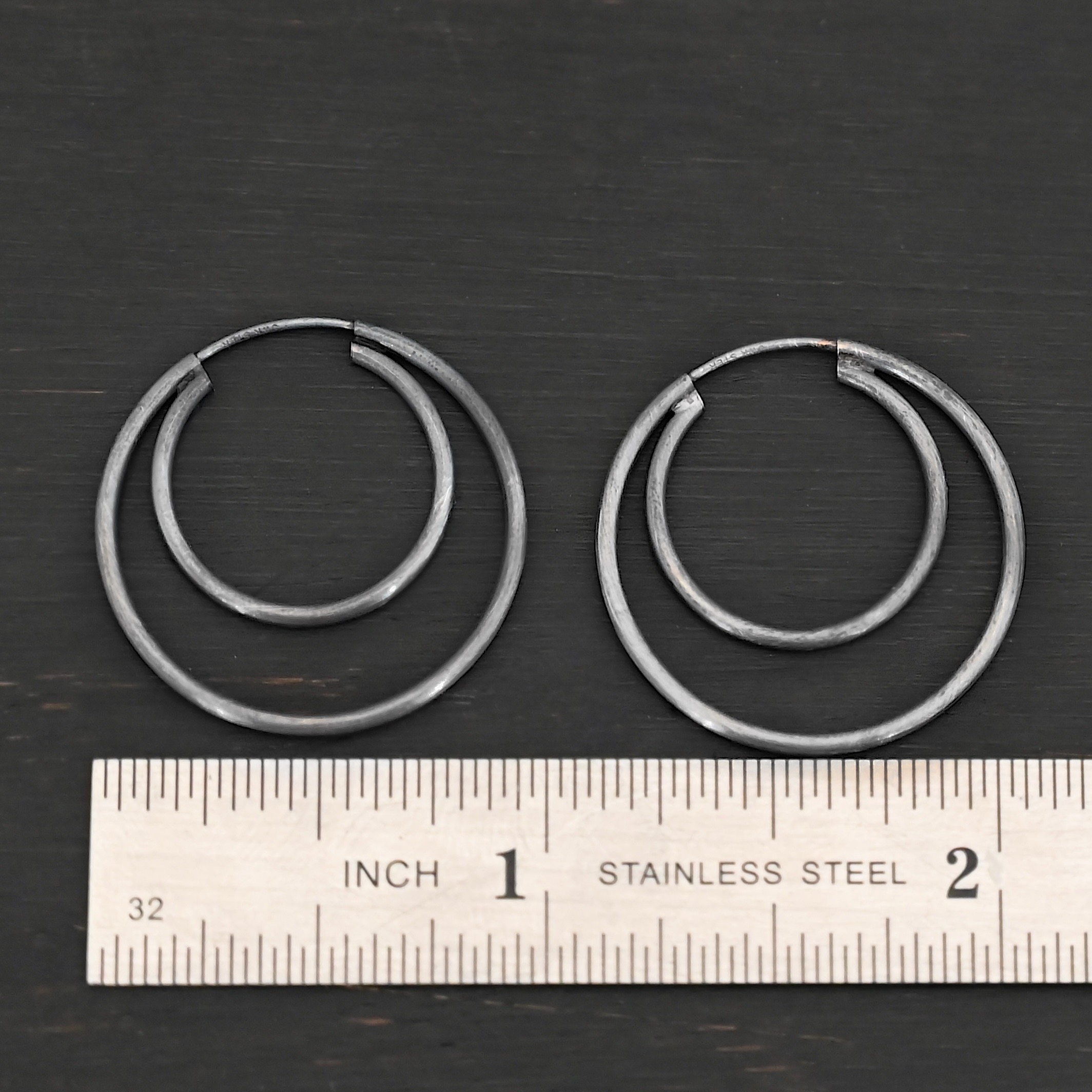 Sterling Silver Fern Double Hoop Earrings 25mm oxidized shown by ruler