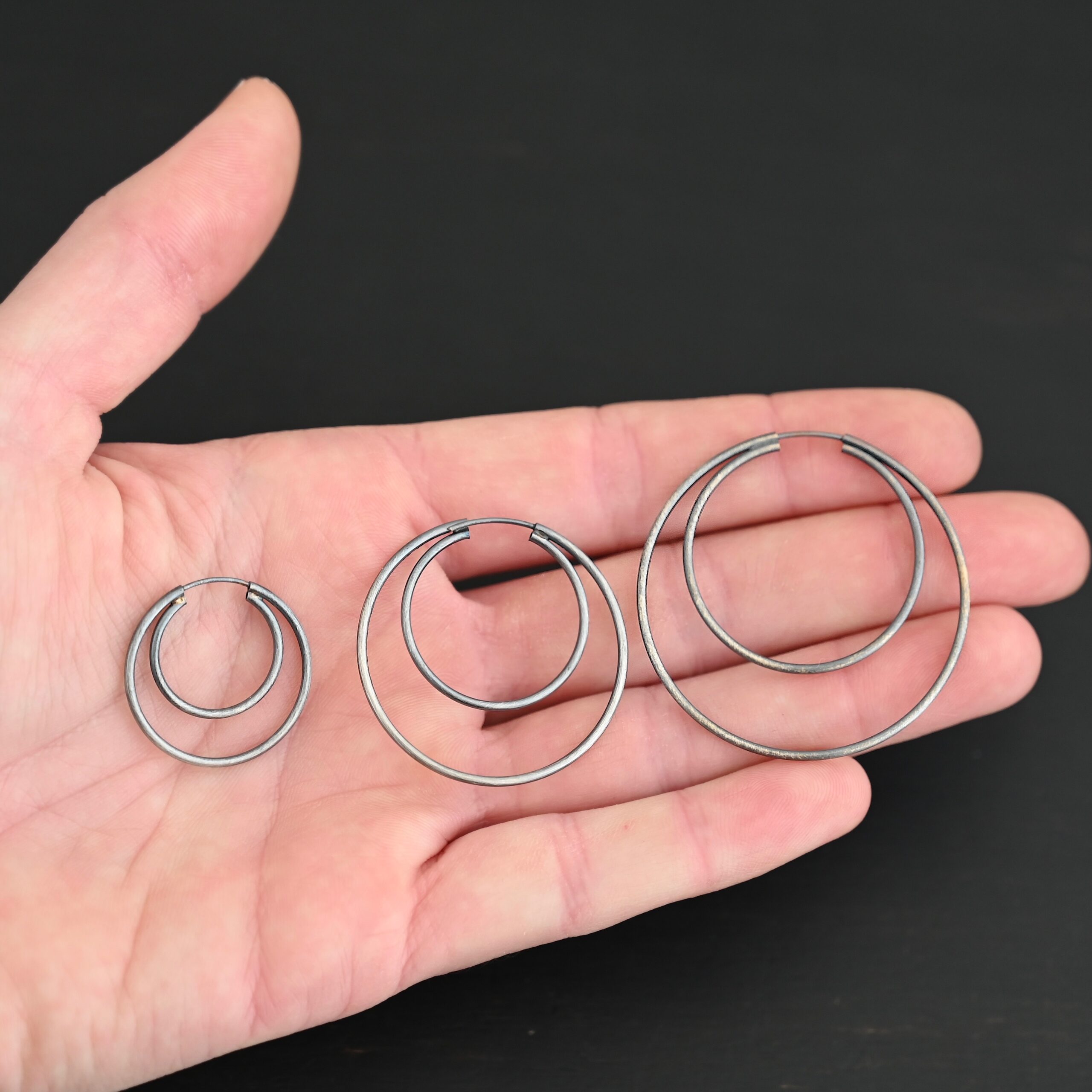 Sterling Silver Fern Double Hoop Earrings all sizes oxidized shown in hand